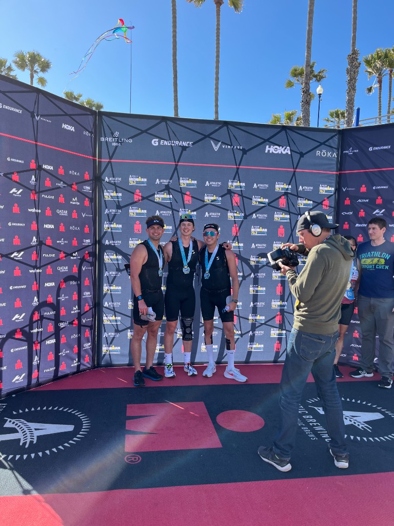 Preston Lau with friends after an Ironman 70.3 triathlon